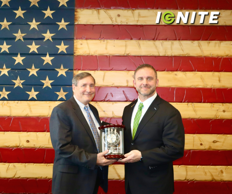 Clayton Hinchman Presents Joe Hatchett with a Clock to Celebrate the Recent Acquisition of Reliant Technologies